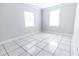 Bright bedroom with tile flooring and two windows at 1411 Overdale St, Orlando, FL 32825
