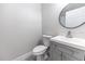 Clean bathroom with gray vanity and white toilet at 1411 Overdale St, Orlando, FL 32825