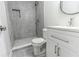 Modern bathroom with gray tile shower and white vanity at 1411 Overdale St, Orlando, FL 32825
