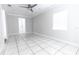 Spacious bedroom with tile floors and ceiling fan at 1411 Overdale St, Orlando, FL 32825