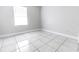 Bright bedroom with tile flooring and a window at 1411 Overdale St, Orlando, FL 32825