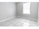 Bright bedroom with tile flooring and a window at 1411 Overdale St, Orlando, FL 32825