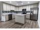 Modern kitchen with stainless steel appliances and an island at 1411 Overdale St, Orlando, FL 32825