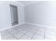 Spacious bedroom with tile flooring and an open doorway at 1411 Overdale St, Orlando, FL 32825