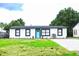 Modern home with paver driveway and a well-maintained lawn at 1411 Overdale St, Orlando, FL 32825