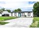 Charming house with modern exterior and a freshly landscaped yard at 1411 Overdale St, Orlando, FL 32825