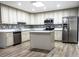 Modern kitchen with stainless steel appliances and an island at 1411 Overdale St, Orlando, FL 32825