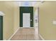 Bright entryway with tile flooring, and two-toned walls at 4957 Whistling Wind Ave, Kissimmee, FL 34758