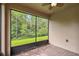 Screened porch overlooking backyard greenery at 790 Shady Canyon Way, Poinciana, FL 34759