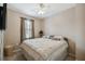 King-size bed in a well-lit bedroom with ceiling fan at 790 Shady Canyon Way, Poinciana, FL 34759