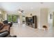 Spacious living room with tile floors, sliding glass doors, and recessed lighting at 790 Shady Canyon Way, Poinciana, FL 34759