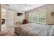 Bright bedroom with a large window and relaxing armchair at 790 Shady Canyon Way, Poinciana, FL 34759
