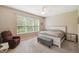 Main bedroom with large window and comfortable seating at 790 Shady Canyon Way, Poinciana, FL 34759