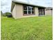 Spacious backyard with view of home exterior at 790 Shady Canyon Way, Poinciana, FL 34759