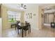 Charming dining room featuring a table with four chairs and decorative wall art at 790 Shady Canyon Way, Poinciana, FL 34759
