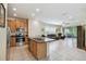 Eat-in kitchen with granite island and stainless steel appliances at 790 Shady Canyon Way, Poinciana, FL 34759