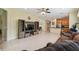 Open concept living room with a view into the kitchen and dining area at 790 Shady Canyon Way, Poinciana, FL 34759