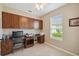 Bright home office features built-in desk and cabinets at 790 Shady Canyon Way, Poinciana, FL 34759