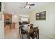 Bright dining area with a table and chairs near the kitchen at 790 Shady Canyon Way, Poinciana, FL 34759