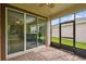 Screened porch with access to backyard and interior view at 790 Shady Canyon Way, Poinciana, FL 34759