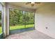 Bright screened porch with paver floor and view of backyard at 790 Shady Canyon Way, Poinciana, FL 34759