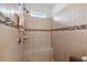 Large shower with tiled walls and built-in seat at 790 Shady Canyon Way, Poinciana, FL 34759