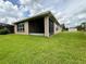 Large backyard with home and screened porch at 790 Shady Canyon Way, Poinciana, FL 34759