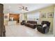 Open living room with tile floors and kitchen view at 790 Shady Canyon Way, Poinciana, FL 34759