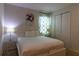 Bright bedroom with a queen-size bed and stylish decor at 3801 Sonoma Blvd, Kissimmee, FL 34741