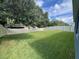 Large backyard with grassy area and privacy fence at 5569 Oro Valley Rd, Auburndale, FL 33823