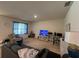 Relaxing living room with comfy seating and a large TV at 5569 Oro Valley Rd, Auburndale, FL 33823