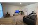 Relaxing living room with comfy seating and TV at 5569 Oro Valley Rd, Auburndale, FL 33823