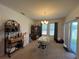 Bright dining area with table and chairs, and access to backyard at 5569 Oro Valley Rd, Auburndale, FL 33823