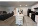 Open kitchen with island and stainless steel appliances at 5569 Oro Valley Rd, Auburndale, FL 33823