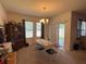 Bright dining room with table and chairs, access to backyard at 5569 Oro Valley Rd, Auburndale, FL 33823