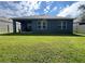 Spacious backyard with grassy area and privacy fence at 5569 Oro Valley Rd, Auburndale, FL 33823