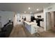 Open kitchen with island and stainless steel appliances at 5569 Oro Valley Rd, Auburndale, FL 33823