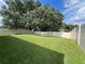 Large backyard with grassy area and privacy fence at 5569 Oro Valley Rd, Auburndale, FL 33823
