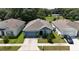 Blue house with gray roof and attached garage at 5569 Oro Valley Rd, Auburndale, FL 33823
