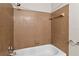 Bathroom with shower/tub combo and brown tile at 3032 Parkway Blvd # 201, Kissimmee, FL 34747