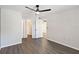 Spacious bedroom with ceiling fan and grey walls at 3032 Parkway Blvd # 201, Kissimmee, FL 34747