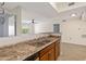 Kitchen with double sink and a view into the living area at 3032 Parkway Blvd # 201, Kissimmee, FL 34747