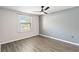 Bright bedroom with ceiling fan and grey accent wall at 3032 Parkway Blvd # 201, Kissimmee, FL 34747