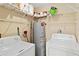 Laundry room with washer, dryer, and ample shelving at 3032 Parkway Blvd # 201, Kissimmee, FL 34747