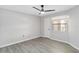 Bedroom with ceiling fan and window coverings at 3032 Parkway Blvd # 201, Kissimmee, FL 34747