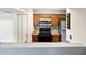 Efficient kitchen featuring wood cabinets and tile backsplash at 3032 Parkway Blvd # 201, Kissimmee, FL 34747
