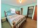 Bedroom with wood bed frame and double closets at 1206 Osceola Ave, Tavares, FL 32778