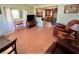 Bright living room with tiled floors and a view into the kitchen at 1206 Osceola Ave, Tavares, FL 32778