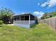 View of house exterior and backyard from the side at 1206 Osceola Ave, Tavares, FL 32778