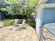 Backyard patio with grill and seating area at 1206 Osceola Ave, Tavares, FL 32778